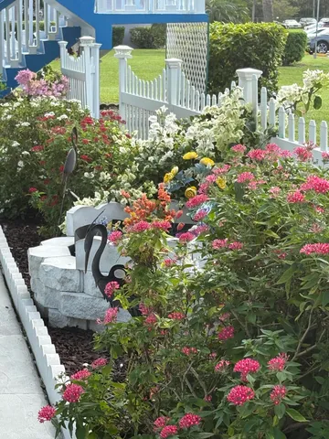 a white stove top oven sitting inside of a kitchen