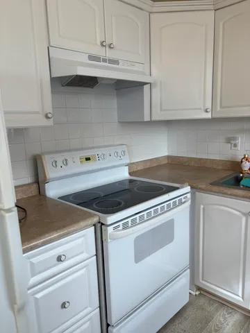 a bathroom with a toilet a sink and bathtub