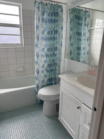 a view of a dining room with furniture and window