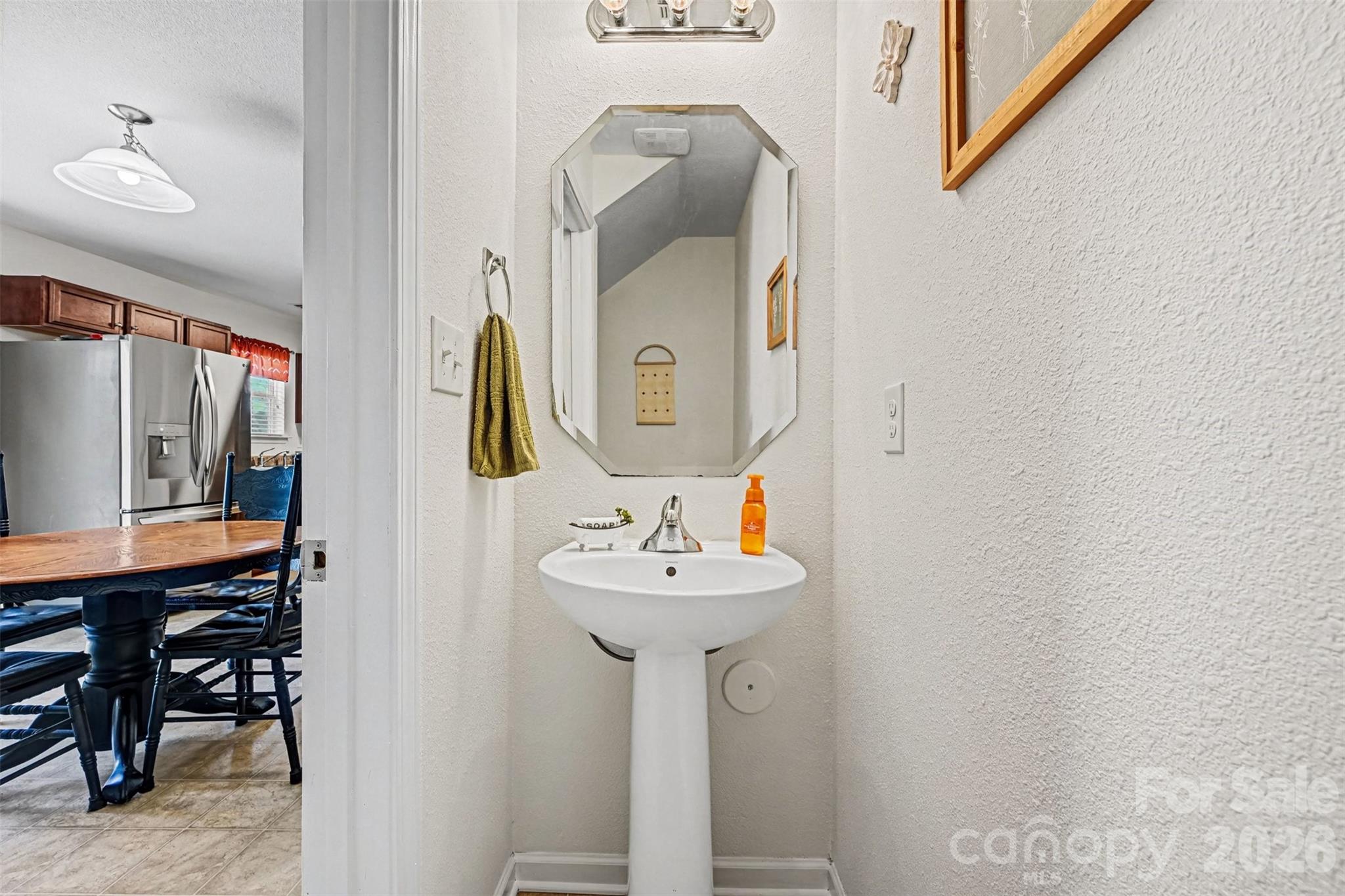 4804 Manchineel Lane Monroe, NC 28110 - Photo 14 of 28 a bathroom with a sink and a mirror
