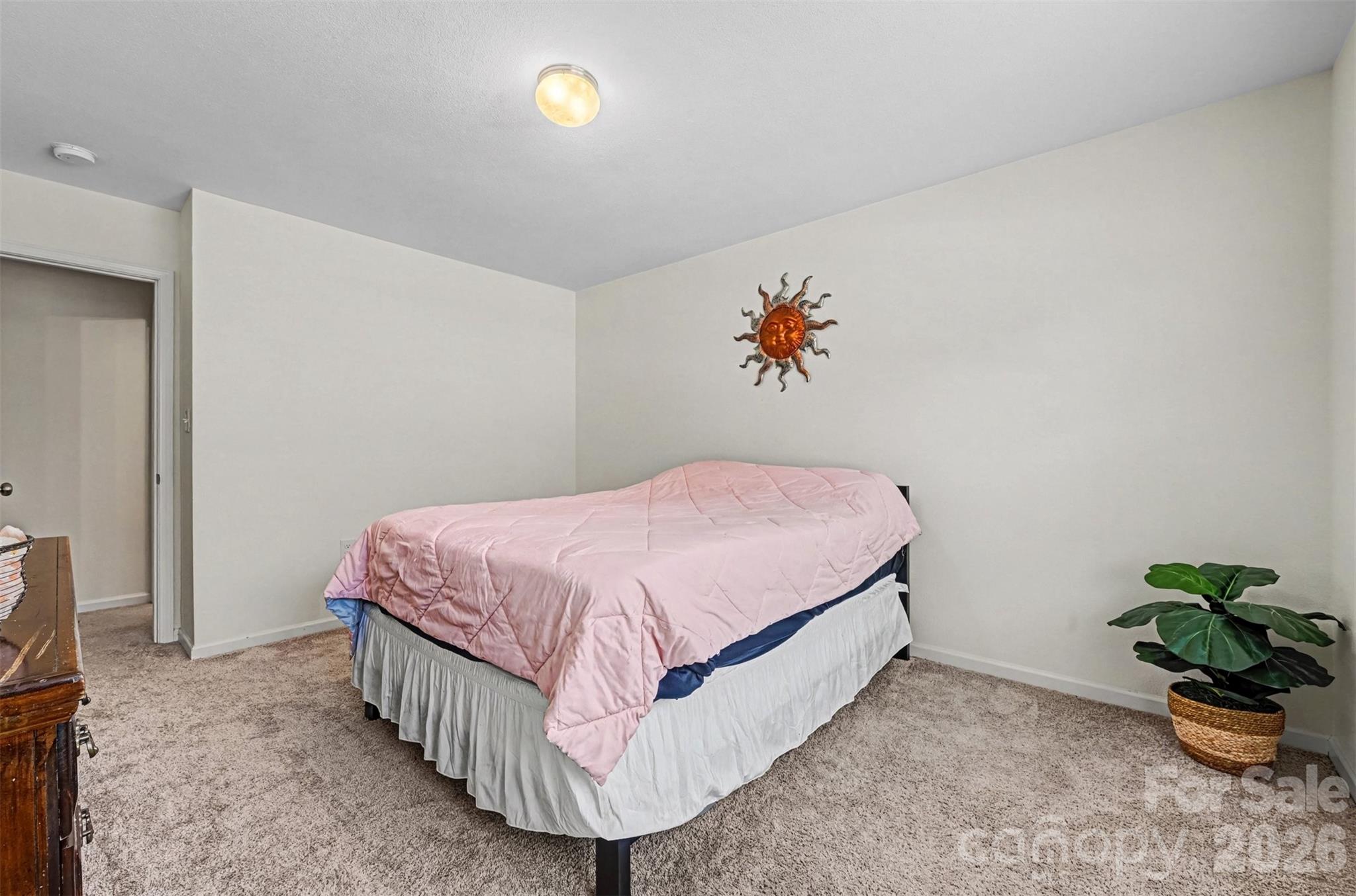 4804 Manchineel Lane Monroe, NC 28110 - Photo 19 of 28 a bedroom with a bed and a painting on the wall