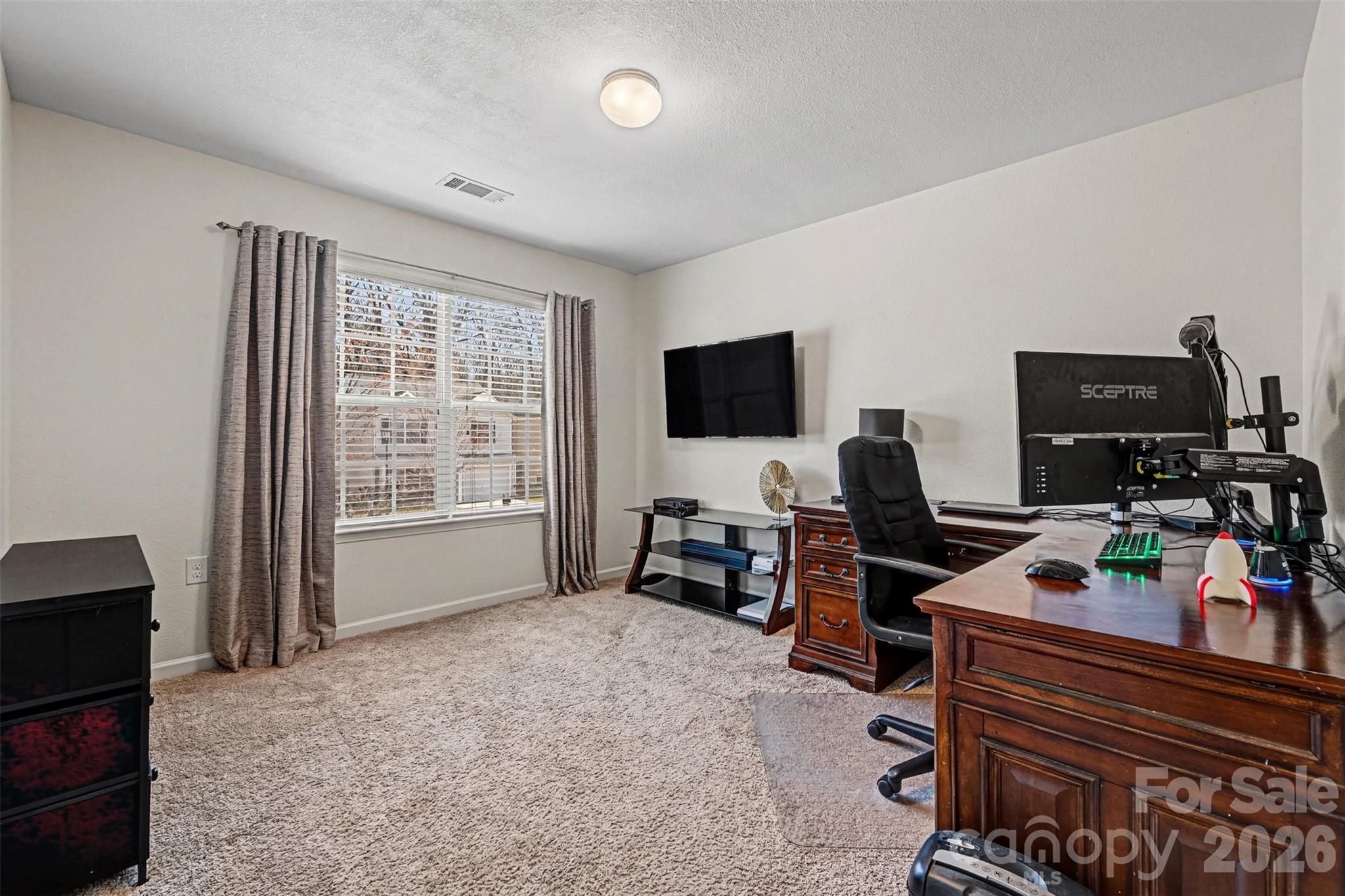 4804 Manchineel Lane Monroe, NC 28110 - Photo 21 of 28 a view of a livingroom with workspace and a window