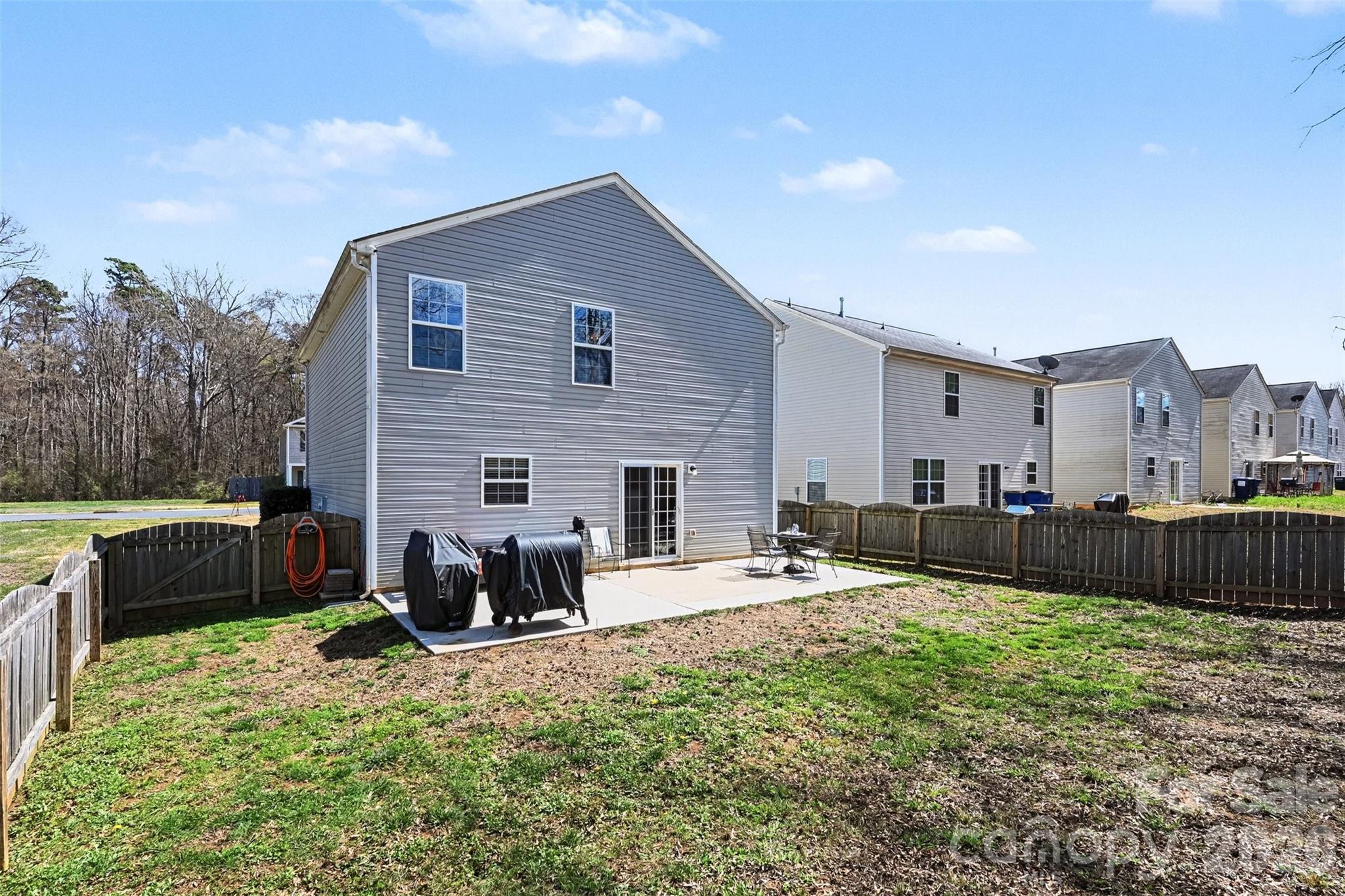 4804 Manchineel Lane Monroe, NC 28110 - Photo 25 of 28 a view of a house with backyard and a chairs