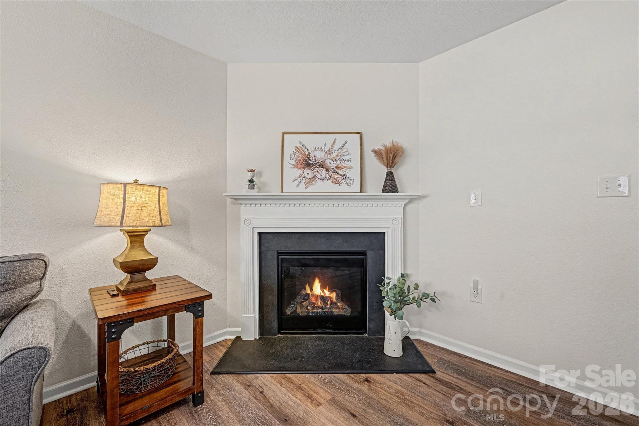4804 Manchineel Lane Monroe, NC 28110 - Photo 4 of 28 a living room with a fireplace and a table