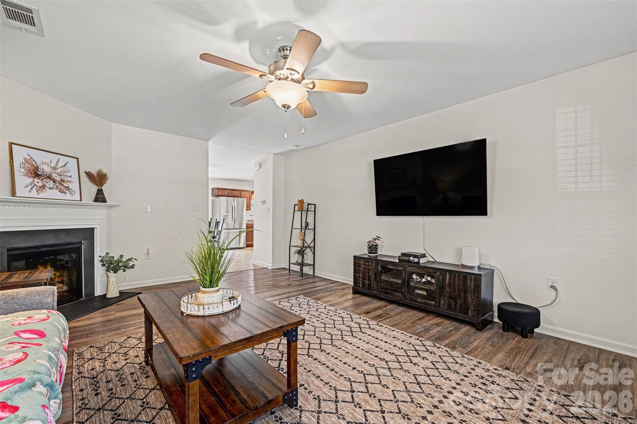 4804 Manchineel Lane Monroe, NC 28110 - Photo 6 of 28 a living room with furniture and a flat screen tv