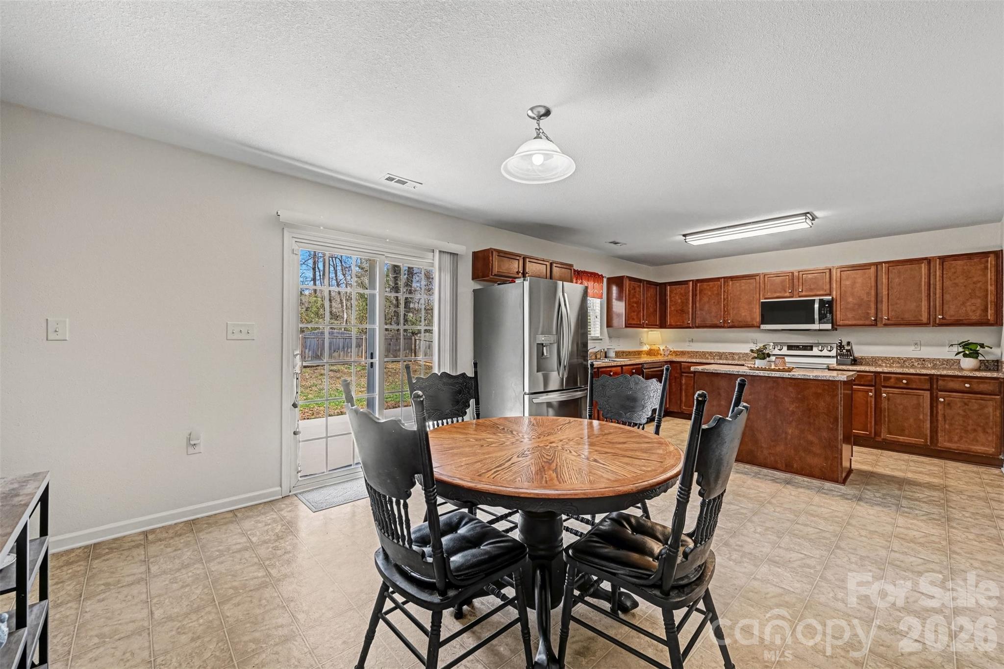 4804 Manchineel Lane Monroe, NC 28110 - Photo 10 of 28 a view of a dining room with furniture and a kitchen