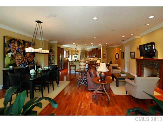 626 Queens Road, Unit 103 Charlotte, NC 28207 - Photo 3 of 16 a living room with lots of furniture and a dining table