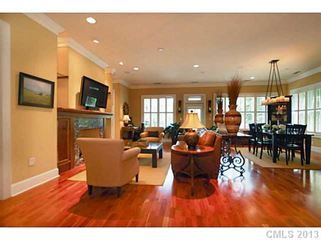 626 Queens Road, Unit 103 Charlotte, NC 28207 - Photo 8 of 16 a living room with lots of furniture and a flat screen tv