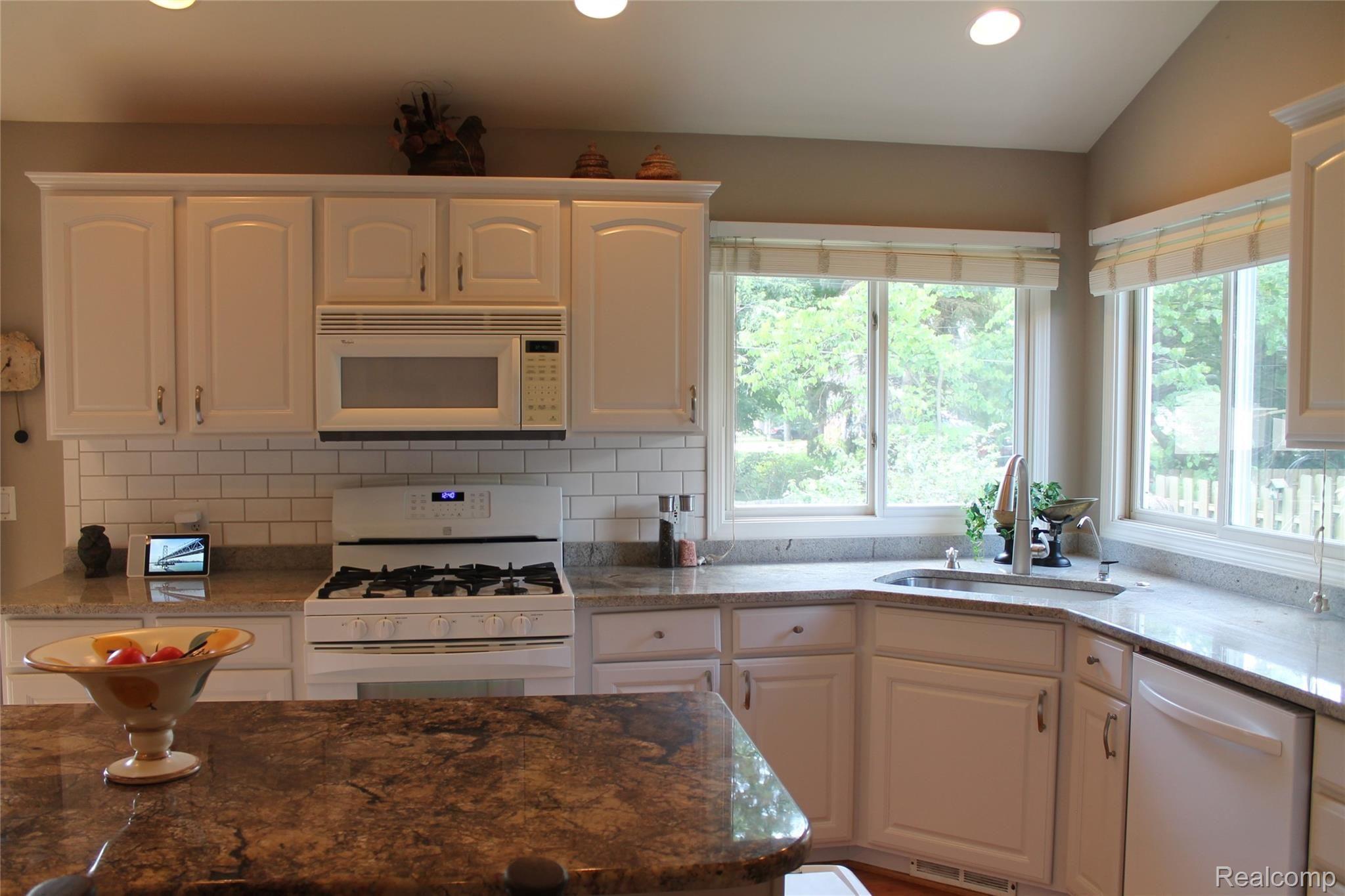 2670 East Wardlow Road Highland, MI 48356 - Photo 15 of 99 Kitchen recently remodeled. Includes all kitchen appliances, washer/dryer, bar fridge, and garage fridge!