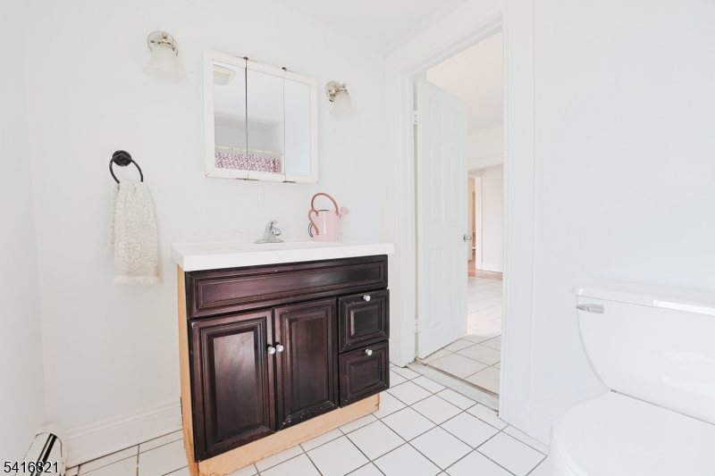 58 Prospect Street, Unit A Dover, NJ 07801 - Photo 10 of 10 a bathroom with a sink and a mirror
