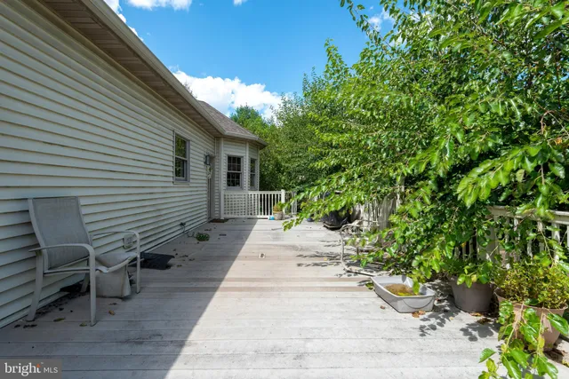 a view of a backyard with sitting area