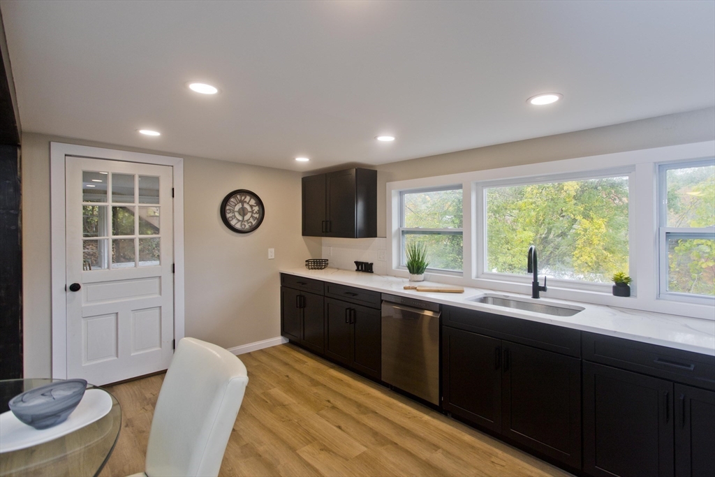 8 Maynard Road Wilbraham, MA 01095 - Photo 12 of 39 a kitchen with a sink windows and white appliances