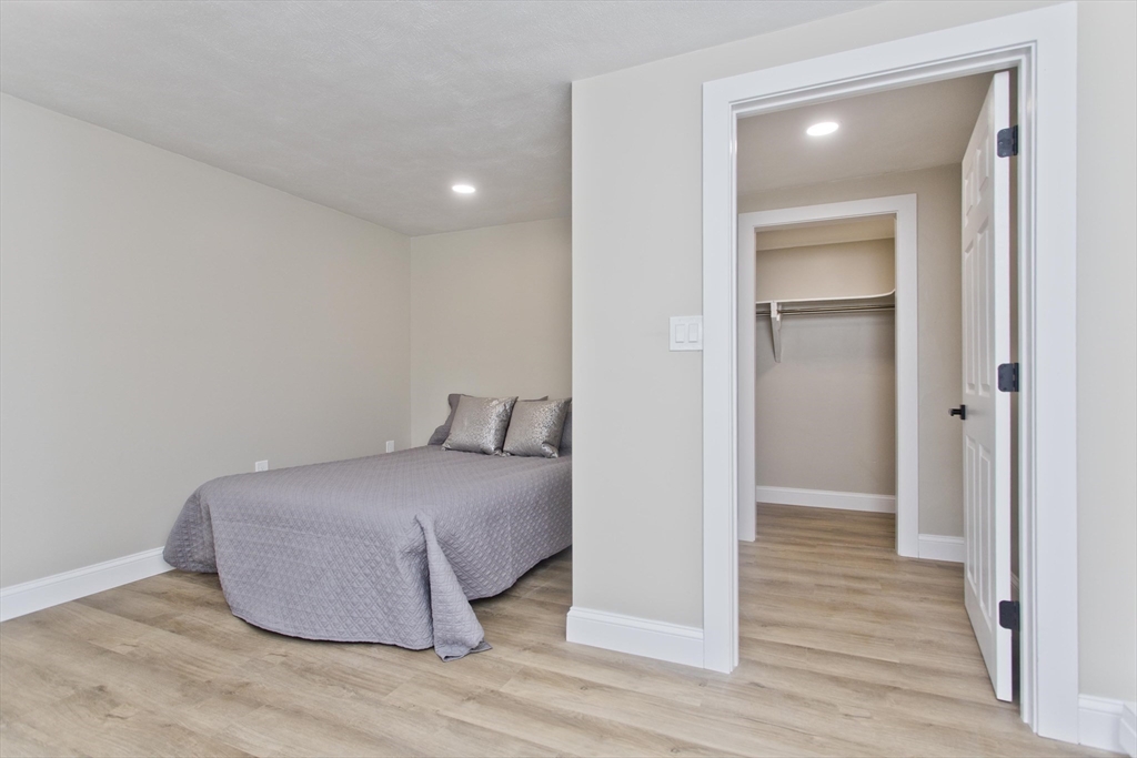 8 Maynard Road Wilbraham, MA 01095 - Photo 25 of 39 a room with a bed and a mirror