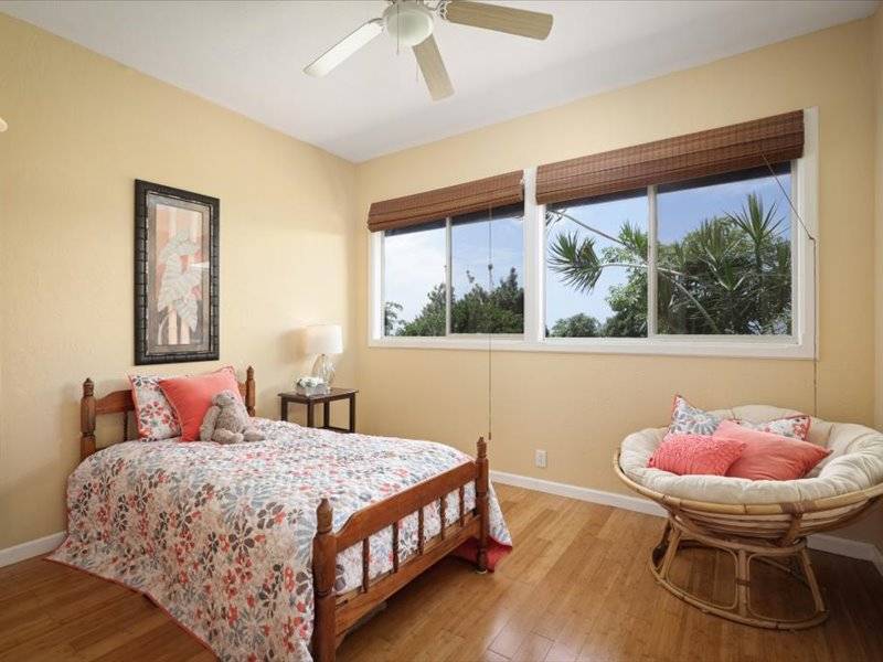 84-5193 Hawaiʻi Belt Road Captain Cook, HI 96704 - Photo 12 of 30 a bedroom with a bed and a window