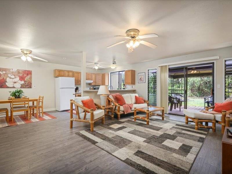 84-5193 Hawaiʻi Belt Road Captain Cook, HI 96704 - Photo 16 of 30 a living room with furniture kitchen view and a large window