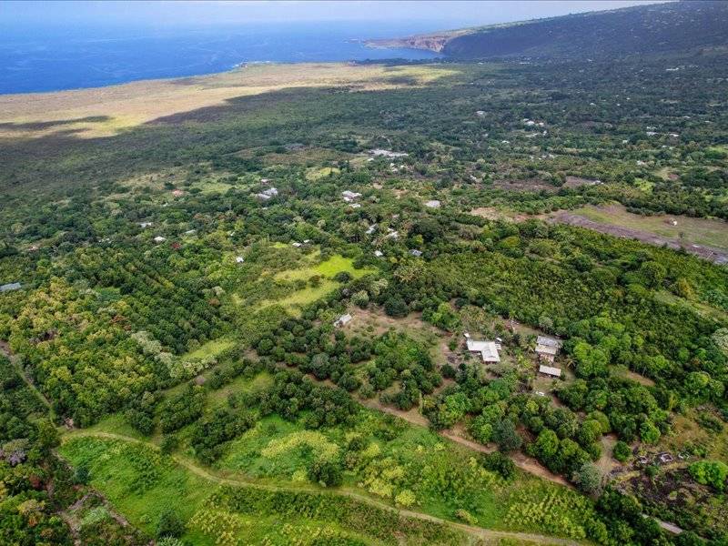 84-5193 Hawaiʻi Belt Road Captain Cook, HI 96704 - Photo 2 of 30 an aerial view of residential houses with outdoor space and trees