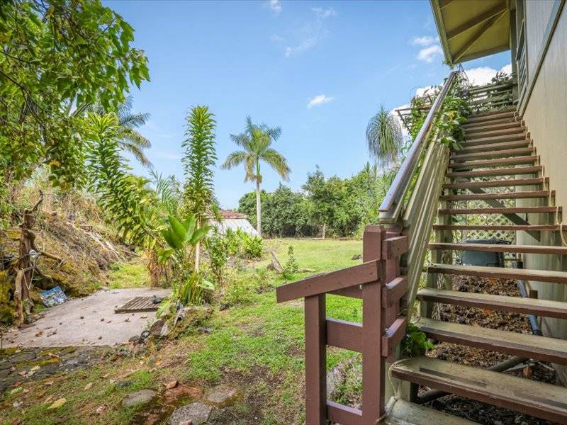 84-5193 Hawaiʻi Belt Road Captain Cook, HI 96704 - Photo 22 of 30 a view of a yard with plants and wooden fence