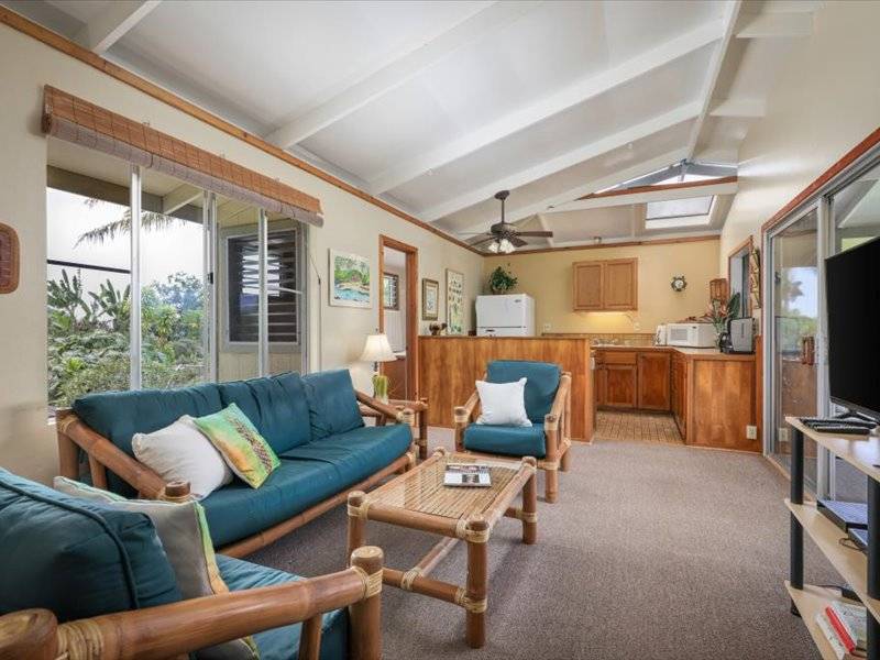 84-5193 Hawaiʻi Belt Road Captain Cook, HI 96704 - Photo 26 of 30 a living room with furniture and a flat screen tv