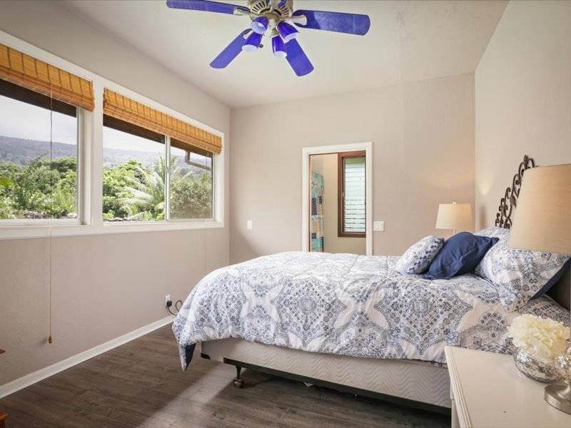 84-5193 Hawaiʻi Belt Road Captain Cook, HI 96704 - Photo 8 of 30 a bedroom with a bed and window