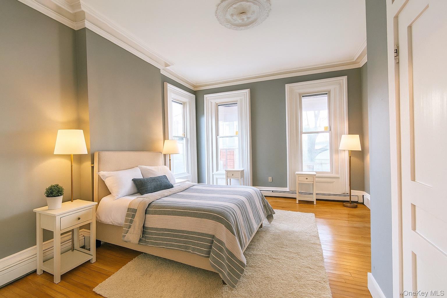 20 Noxon Street, Unit 1 Poughkeepsie, NY 12601 - Photo 7 of 15 a bedroom with a bed and a window