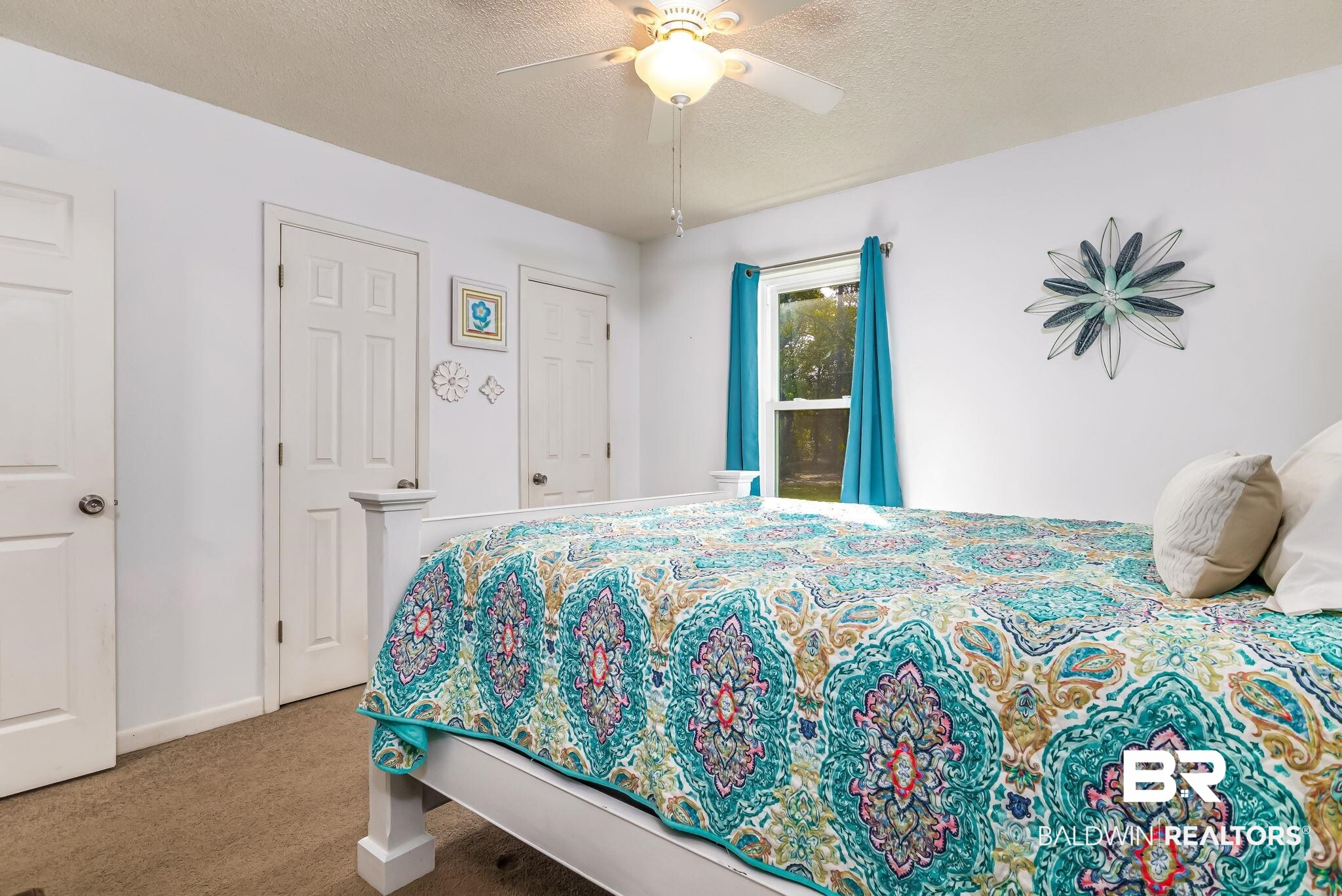 12199 Bay Road West Foley, AL 36535 - Photo 37 of 62 Bedroom featuring a textured ceiling, carpet flooring, and ceiling fan