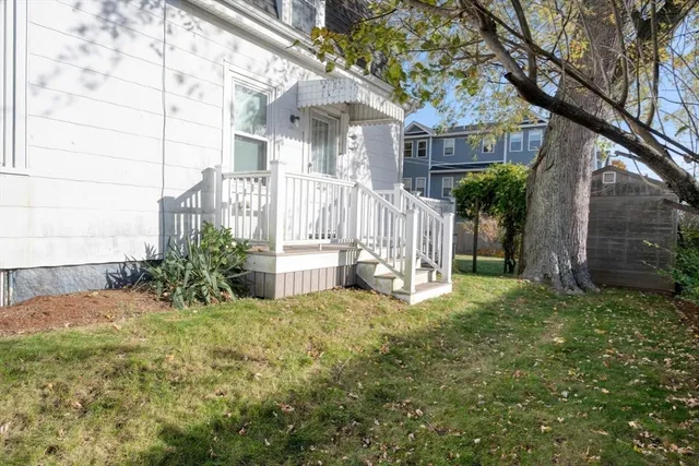 a view of a house with a yard and plants