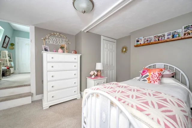 a bedroom with a bed and a cabinets