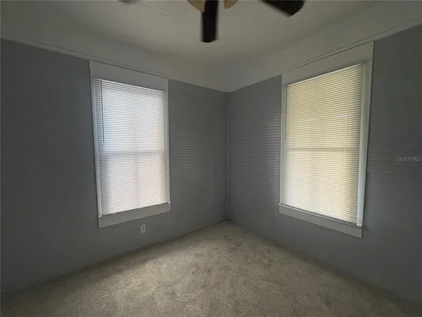 an empty room with windows