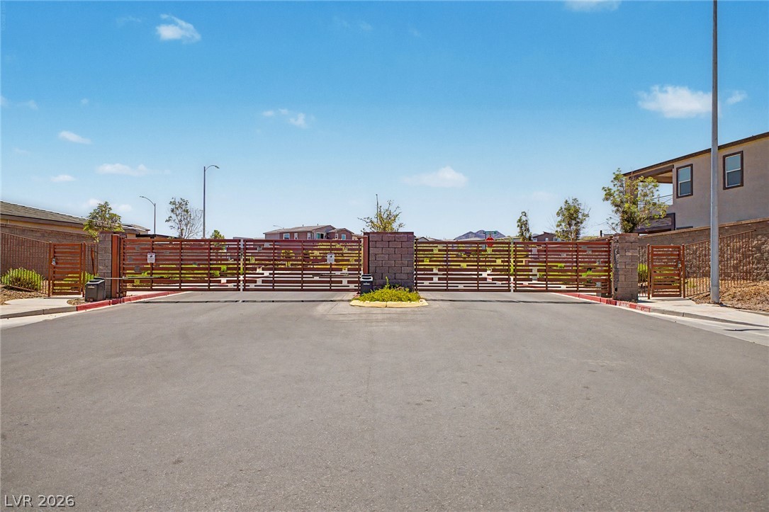 226 Augusta Ridge Henderson, NV 89015 - Photo 34 of 47 Secure community entrance with modern gating and surrounding residential architecture.