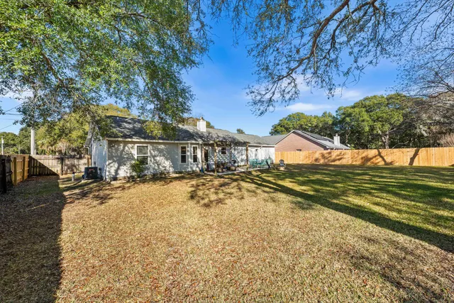 a view of a house with a yard covered with snow in the background