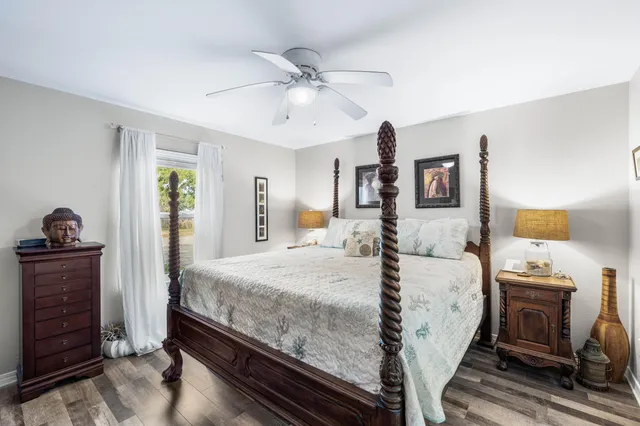 a bed room with a bed and dresser