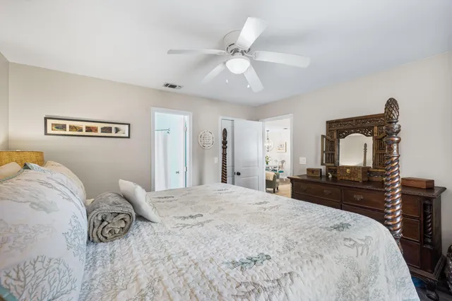 a bedroom with a bed and a dresser