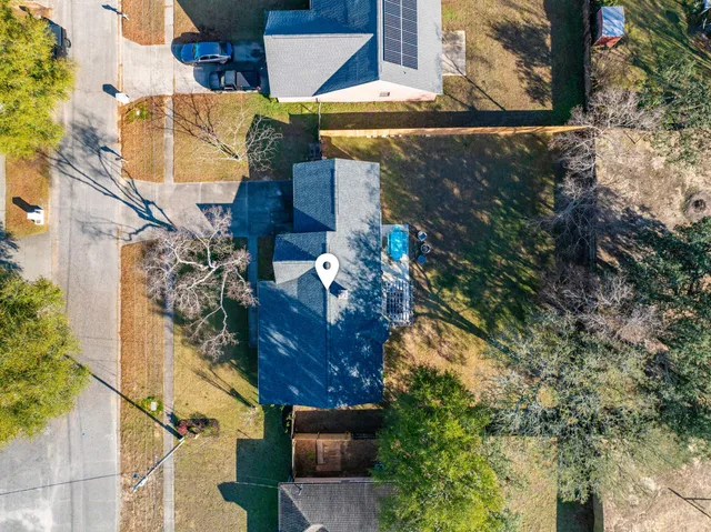 a view of a house with a tree
