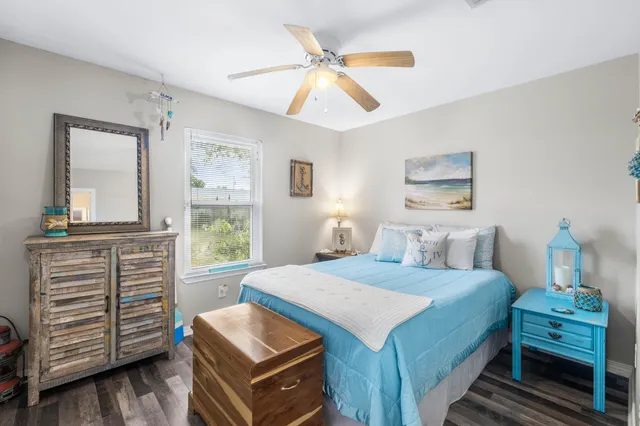 a bedroom with a bed and a dresser