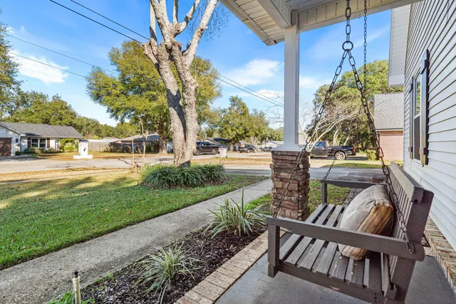 a view of a porch with a yard
