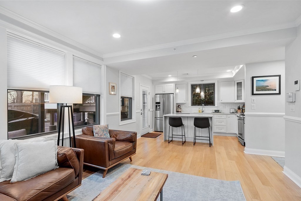 30 Iffley Road, Unit 1 Boston, MA 02130 - Photo 11 of 29 a living room with lots of furniture and view of kitchen