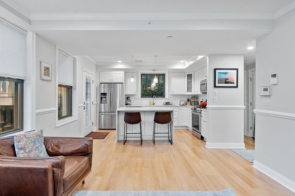 30 Iffley Road, Unit 1 Boston, MA 02130 - Photo 12 of 29 a living room with furniture and kitchen view