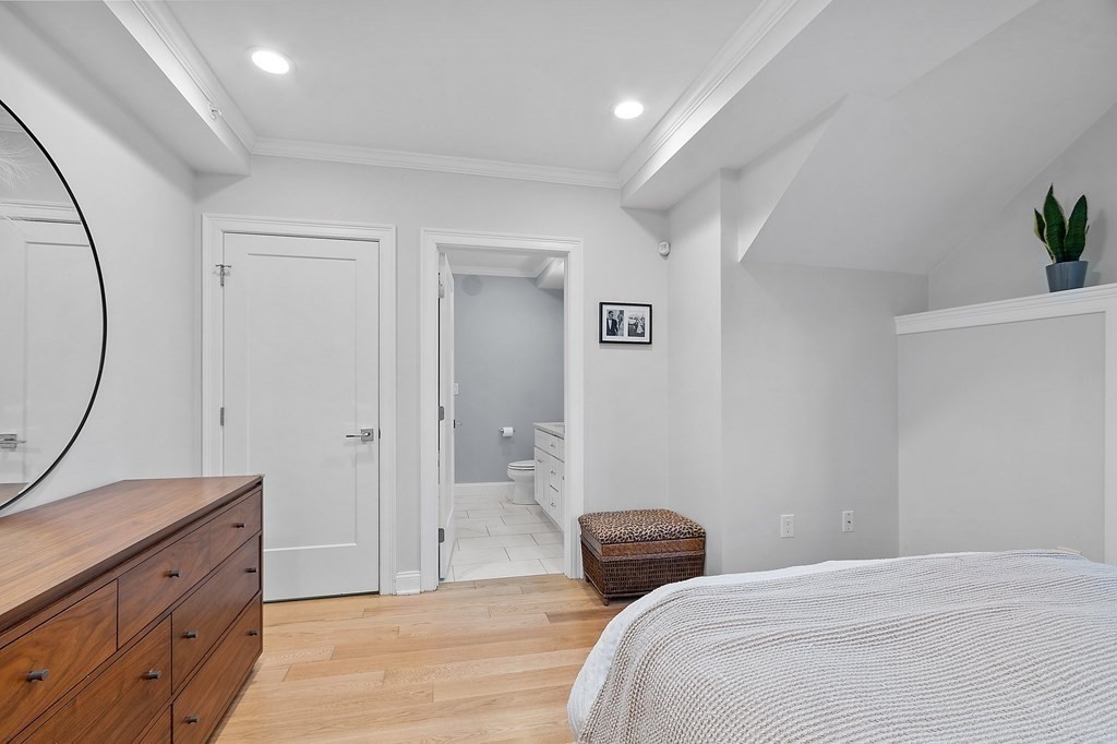30 Iffley Road, Unit 1 Boston, MA 02130 - Photo 14 of 29 a bedroom with a bed and a dresser