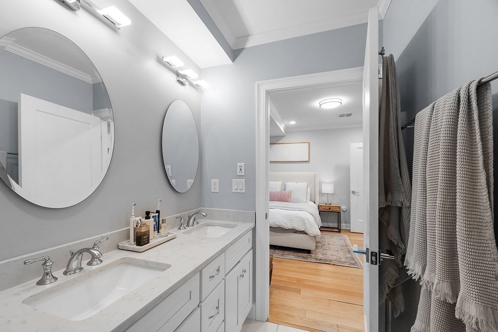 30 Iffley Road, Unit 1 Boston, MA 02130 - Photo 19 of 29 a en suite bathroom with a double vanity sink and a mirror