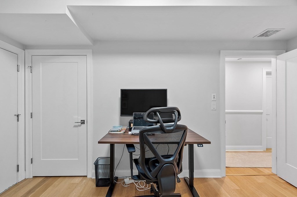 30 Iffley Road, Unit 1 Boston, MA 02130 - Photo 24 of 29 a workspace with furniture and wooden floor