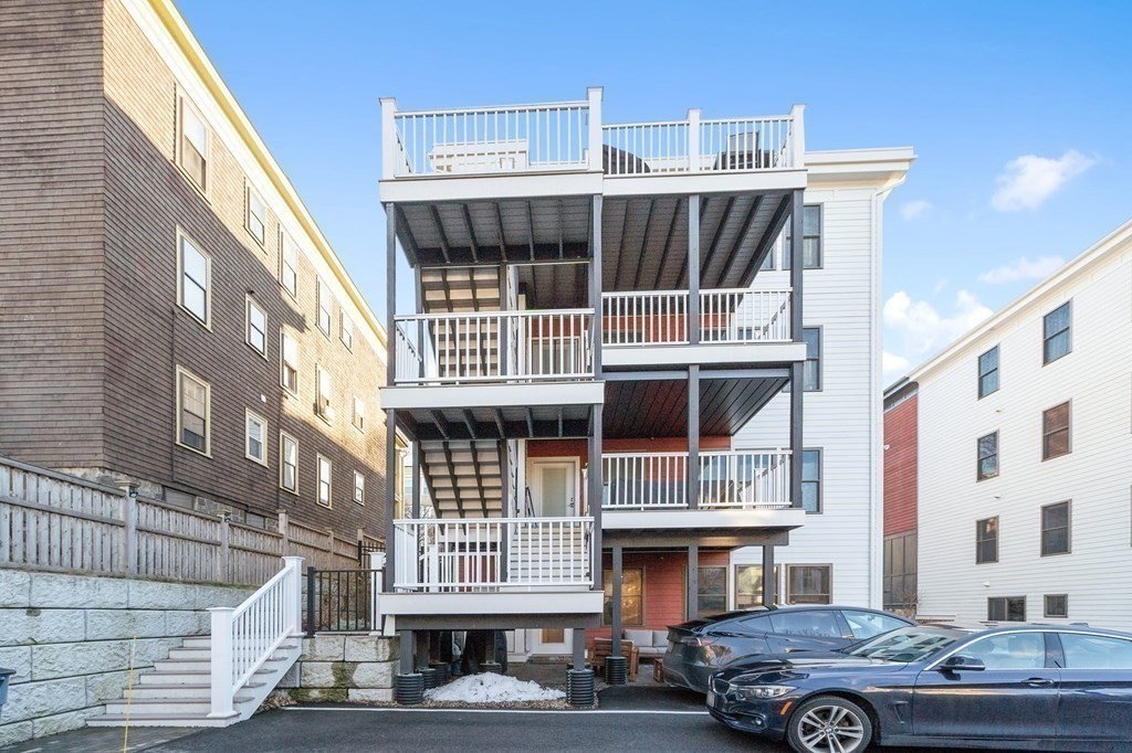 30 Iffley Road, Unit 1 Boston, MA 02130 - Photo 27 of 29 a front view of a building with parking space