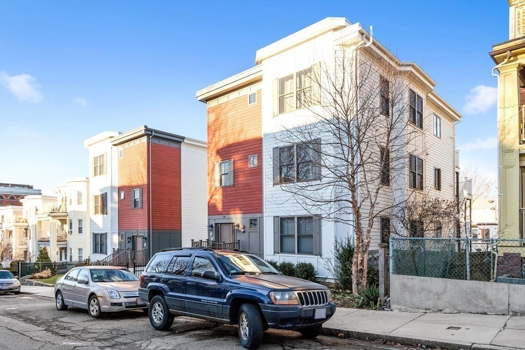 30 Iffley Road, Unit 1 Boston, MA 02130 - Photo 28 of 29 a car parked in front of a brick building