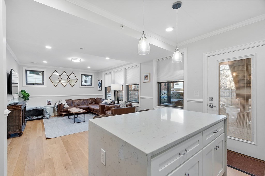 30 Iffley Road, Unit 1 Boston, MA 02130 - Photo 6 of 29 a large white kitchen with a large counter top appliances and cabinets