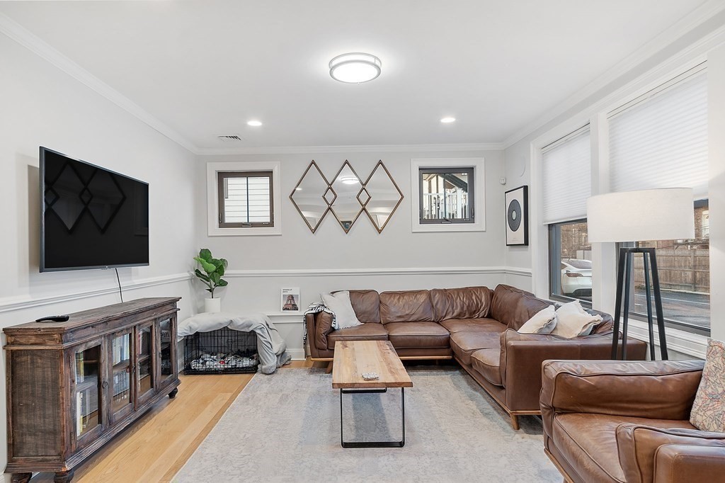 30 Iffley Road, Unit 1 Boston, MA 02130 - Photo 8 of 29 a living room with furniture and a flat screen tv