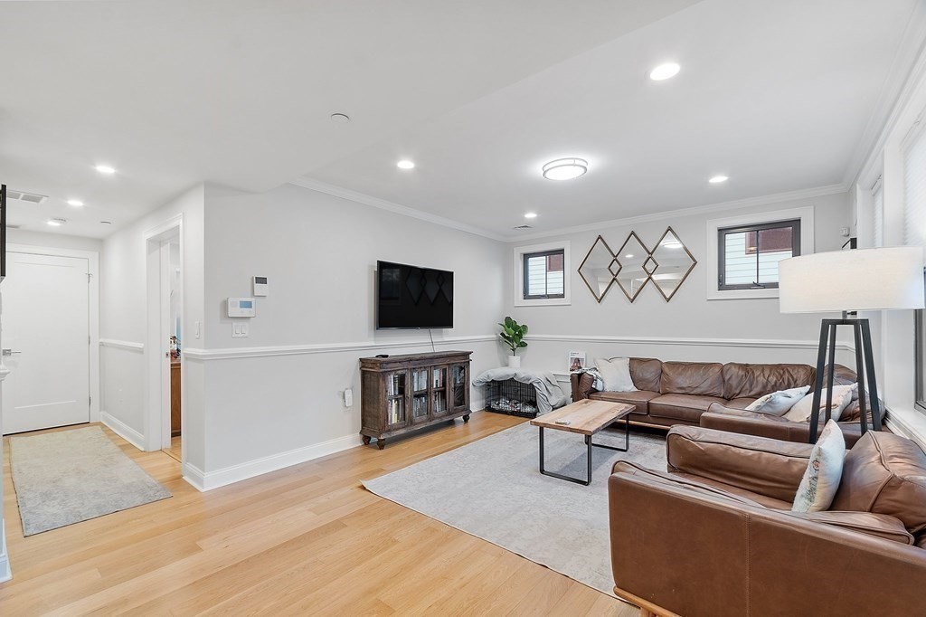 30 Iffley Road, Unit 1 Boston, MA 02130 - Photo 9 of 29 a living room with furniture and a flat screen tv