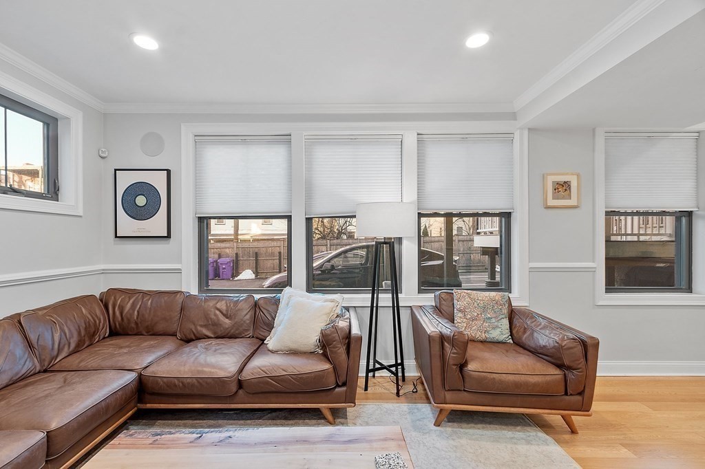 30 Iffley Road, Unit 1 Boston, MA 02130 - Photo 10 of 29 a living room with a couch and a window