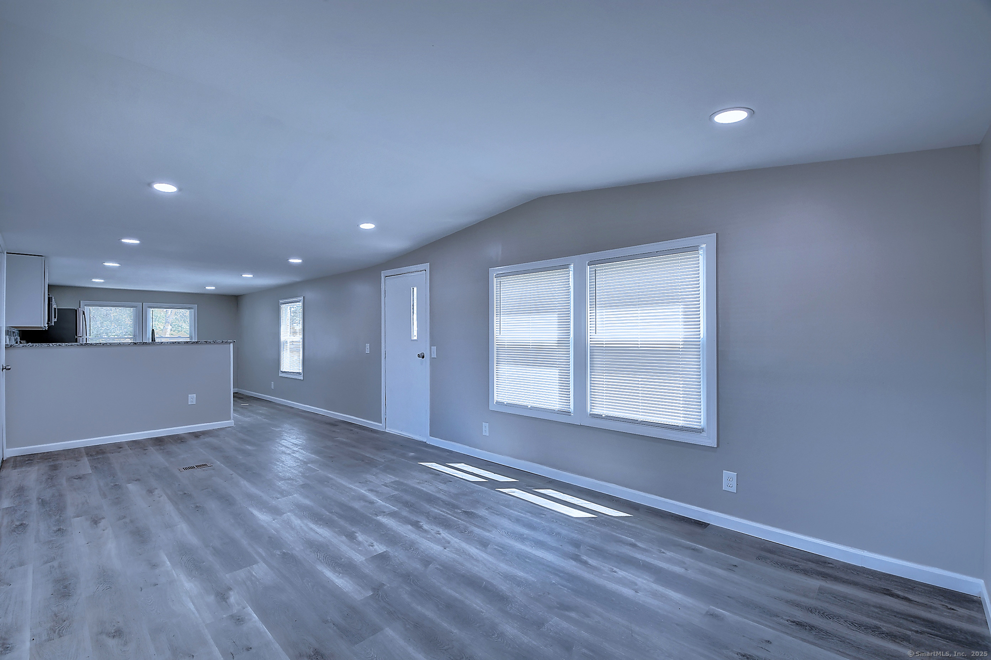 66 Nancy Lane Naugatuck, CT 06770 - Photo 11 of 25 a view of empty room with wooden floor and fan