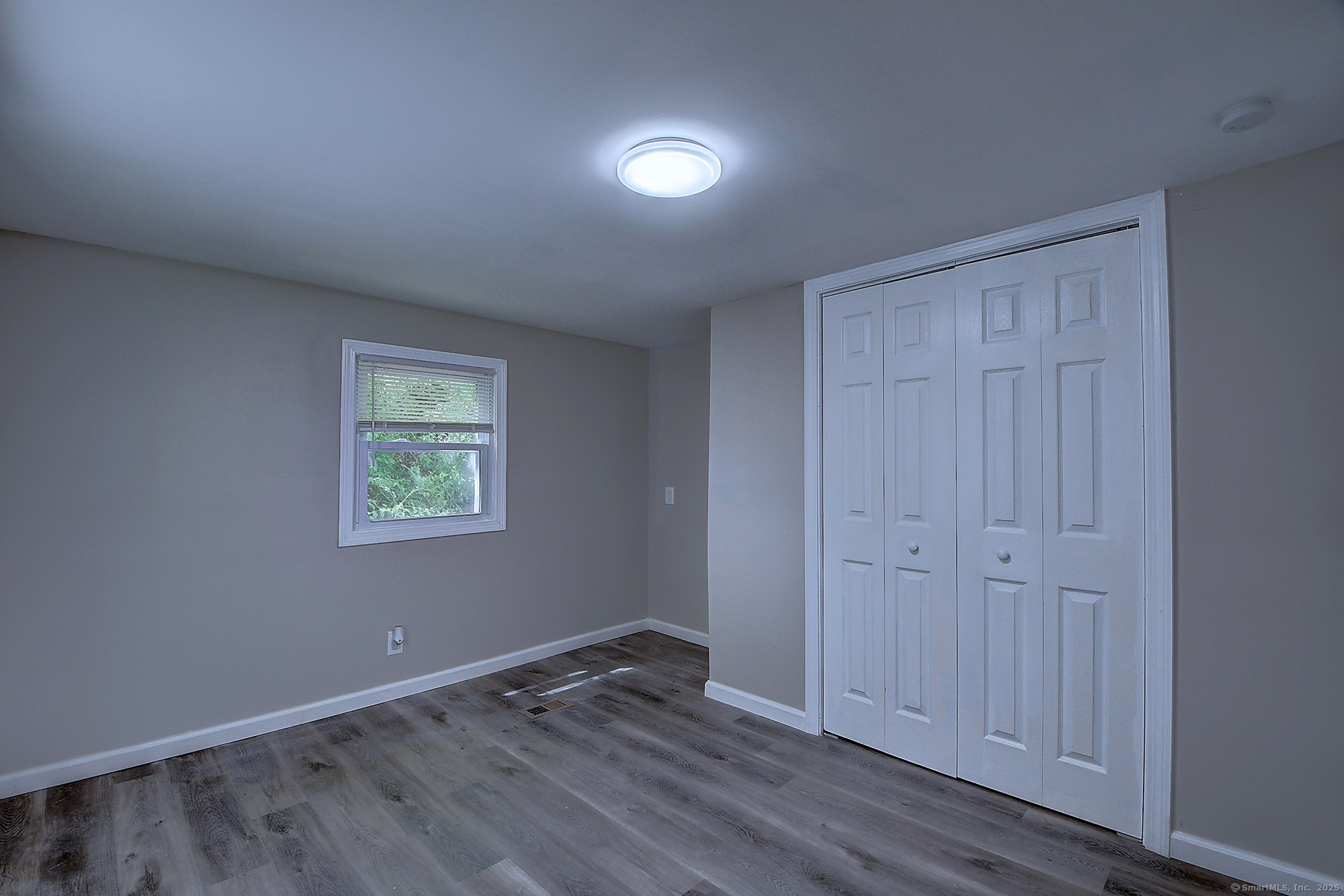 66 Nancy Lane Naugatuck, CT 06770 - Photo 14 of 25 an empty room with wooden floor and closet