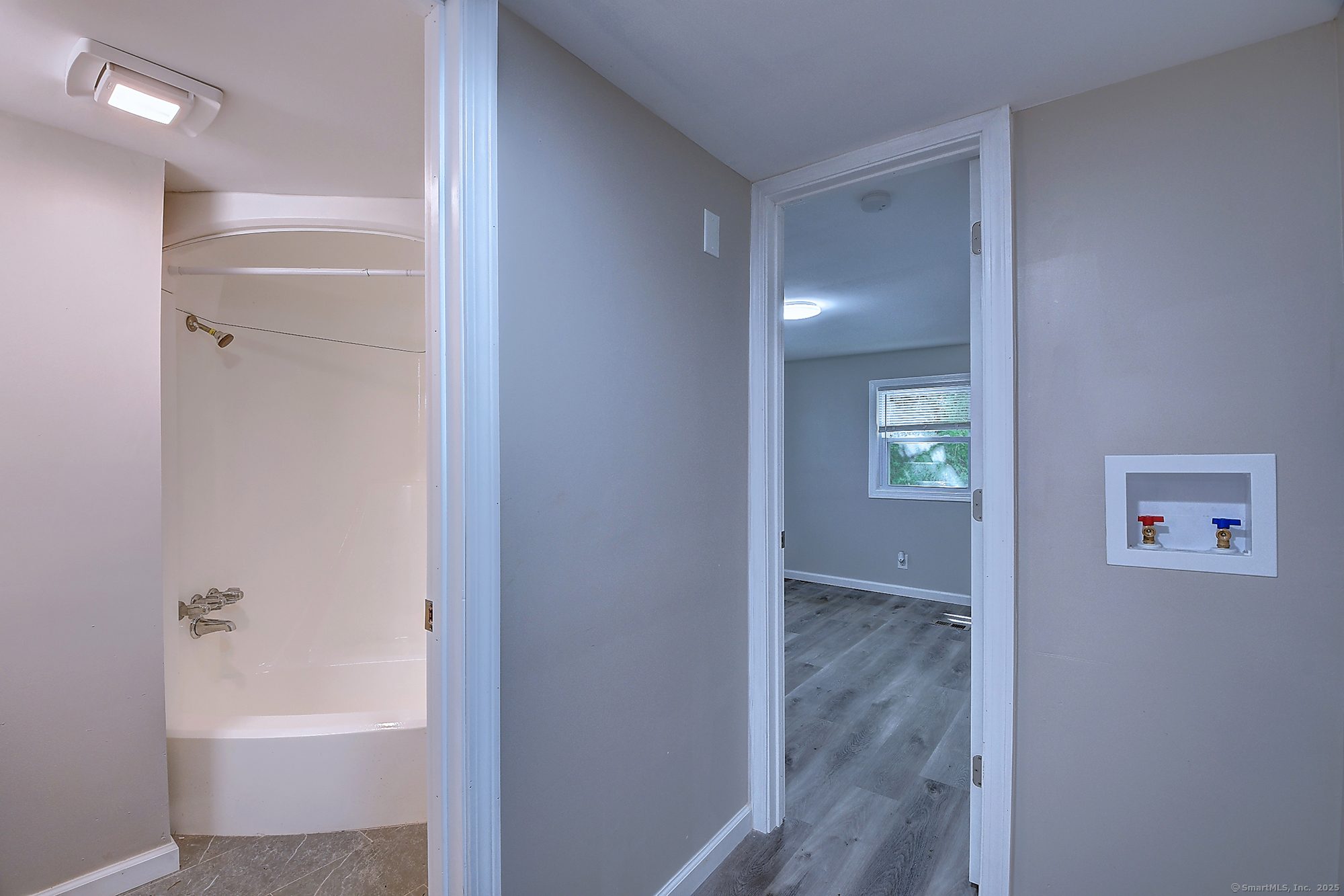 66 Nancy Lane Naugatuck, CT 06770 - Photo 16 of 25 a bathroom with a bathtub and a shower