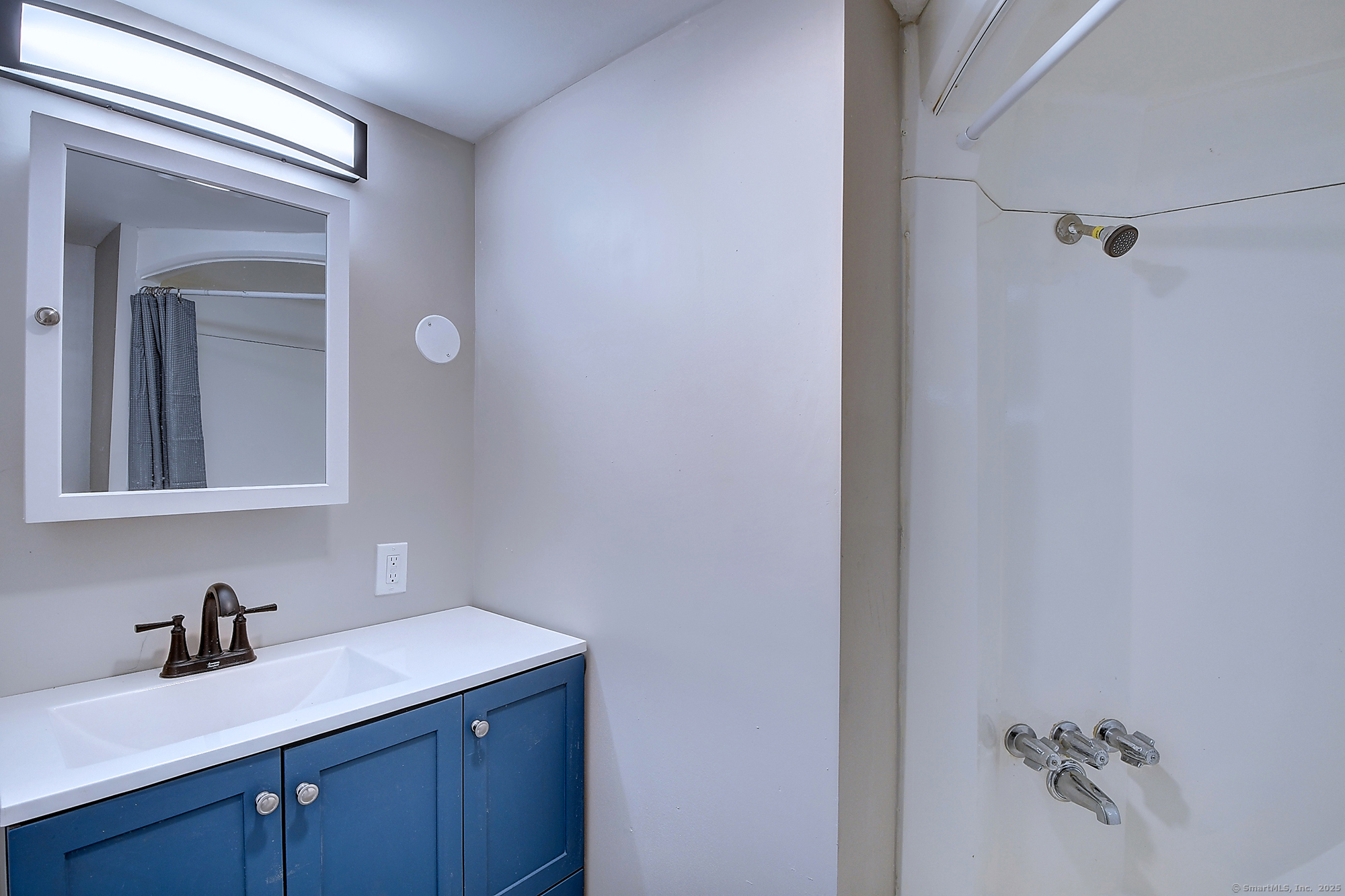 66 Nancy Lane Naugatuck, CT 06770 - Photo 17 of 25 a bathroom with a granite countertop sink a mirror and shower